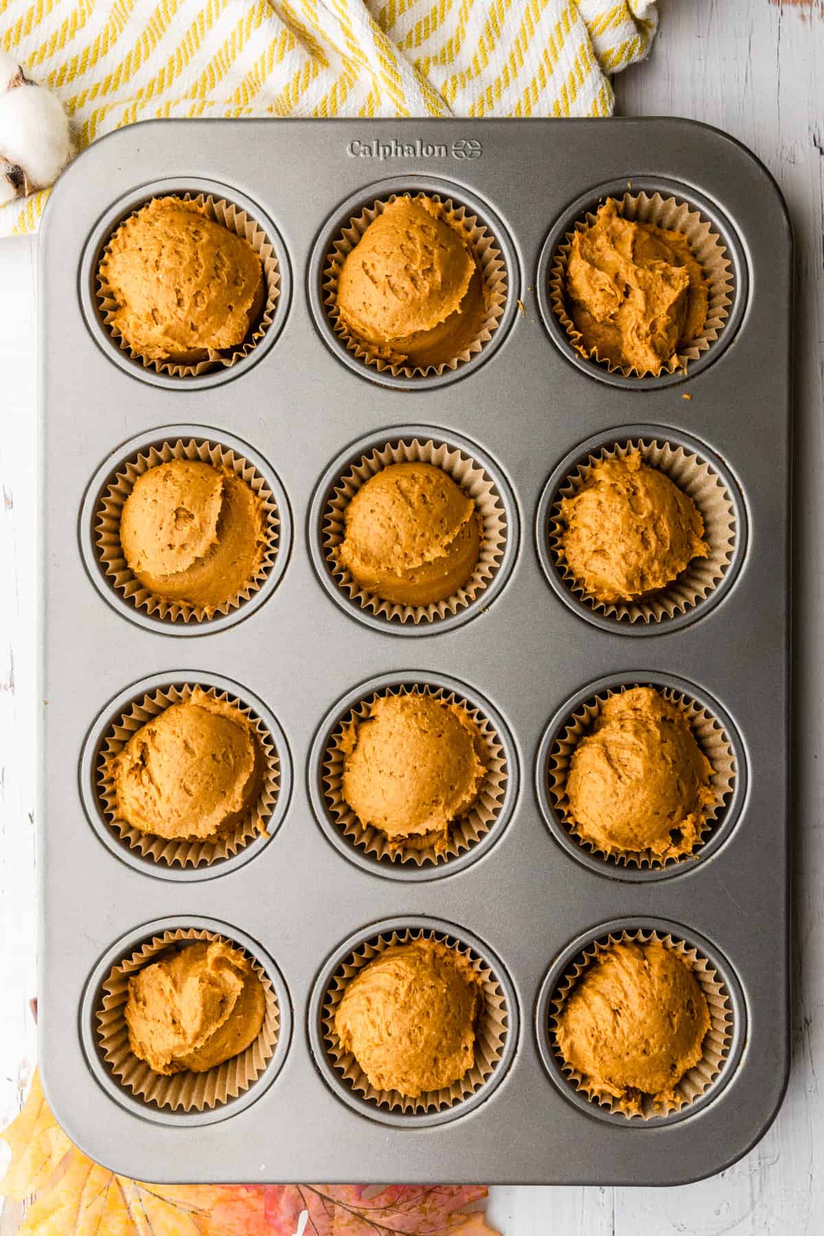 muffins in a tin before baking