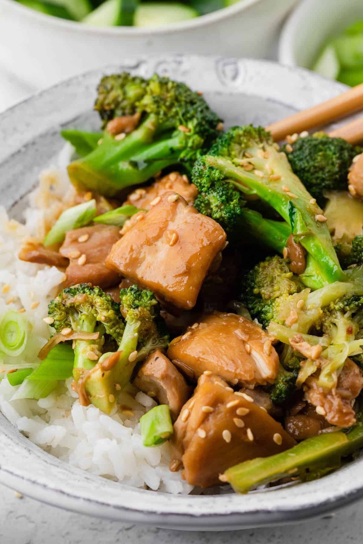 serving chicken and broccoli over rice