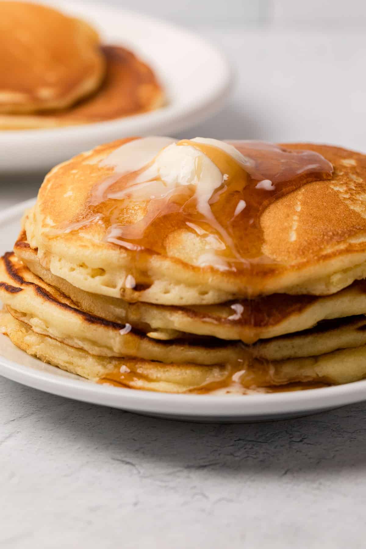 a stack of pancakes covered in syrup