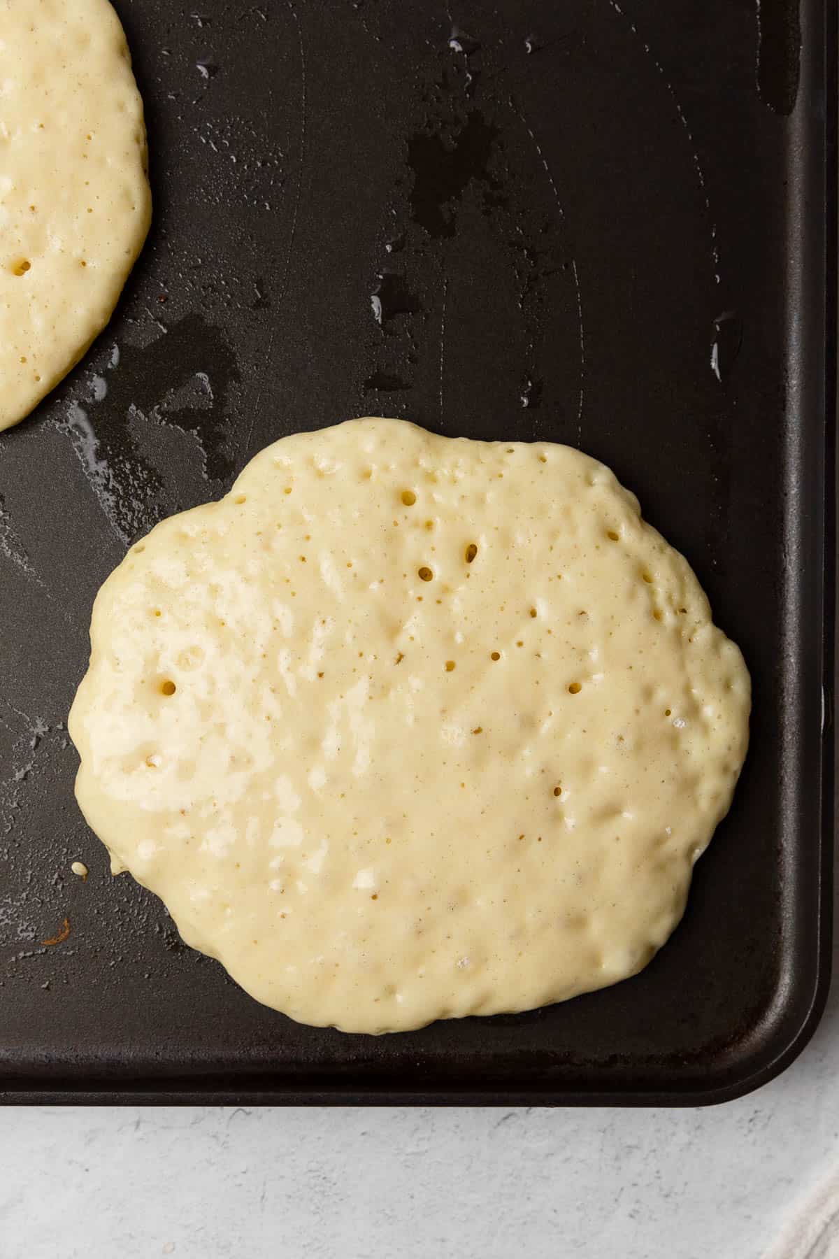 cooking a pancake on a griddle