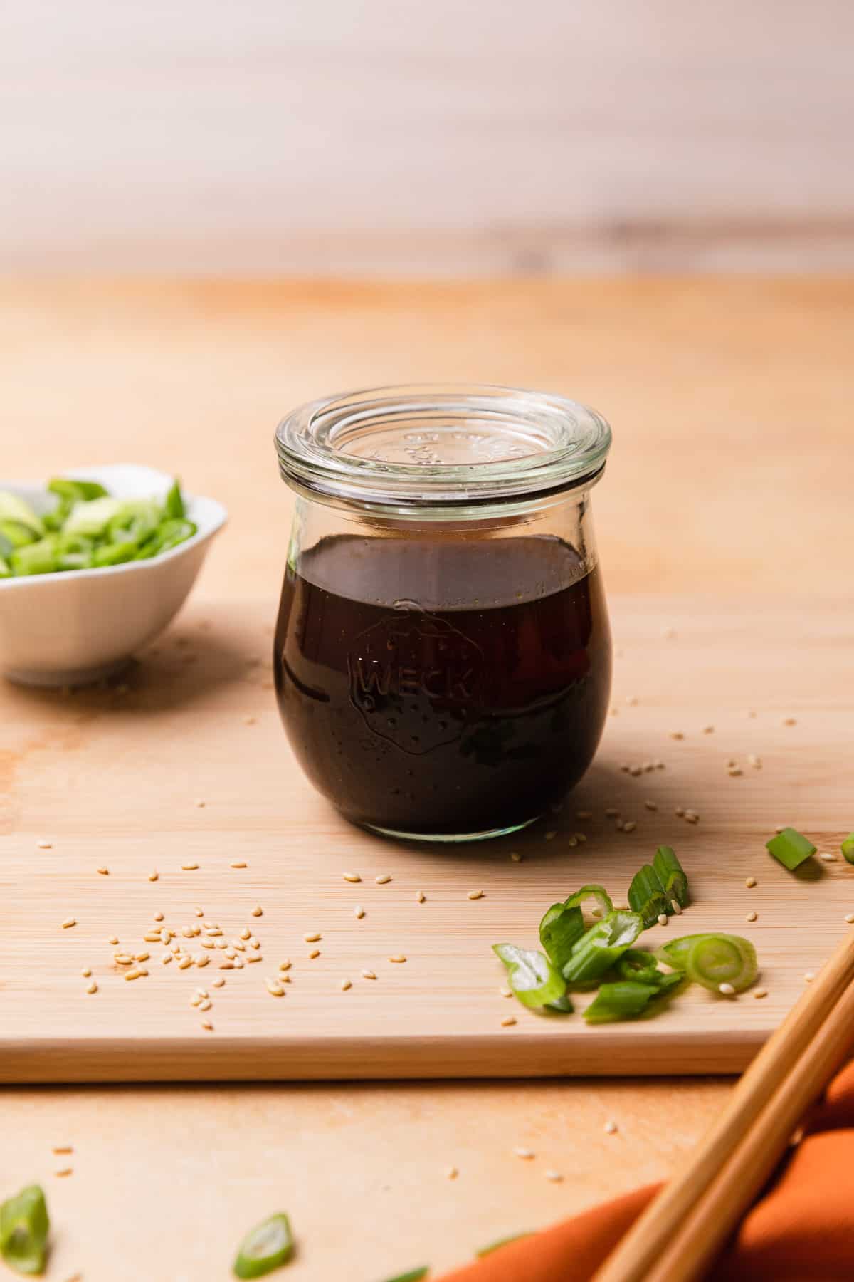 a glass jar of dark sauce