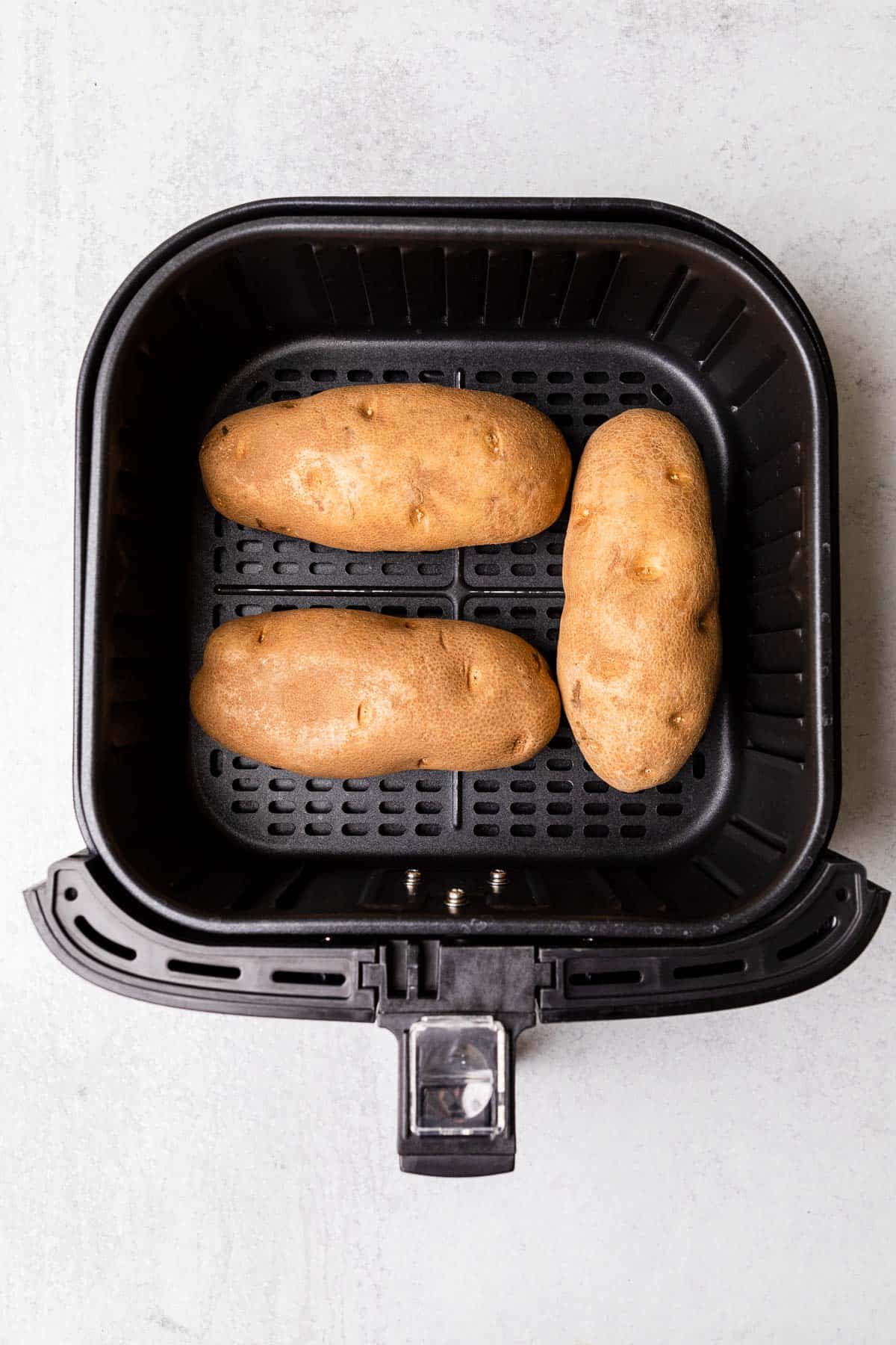 making the recipe with potatoes in an air fryer