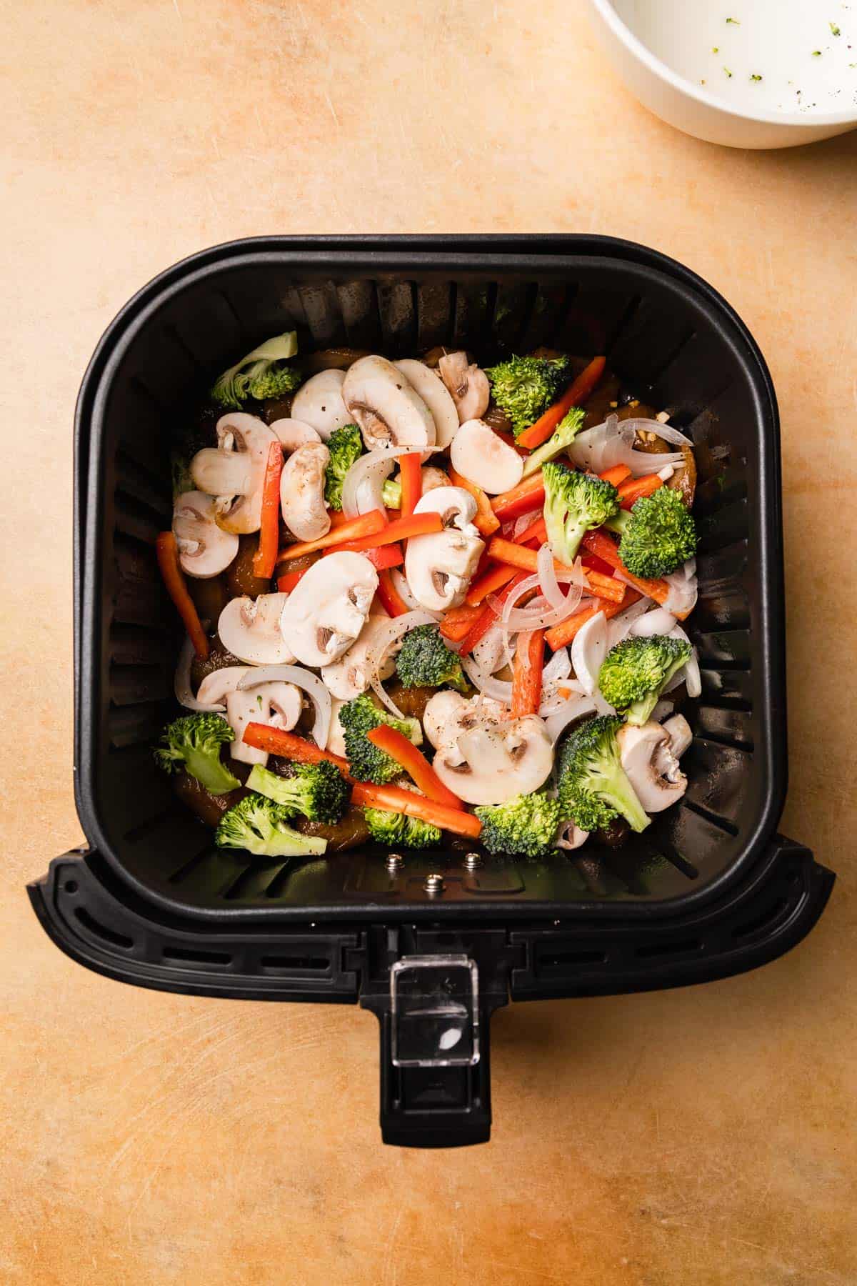 vegetables in an air fryer basket