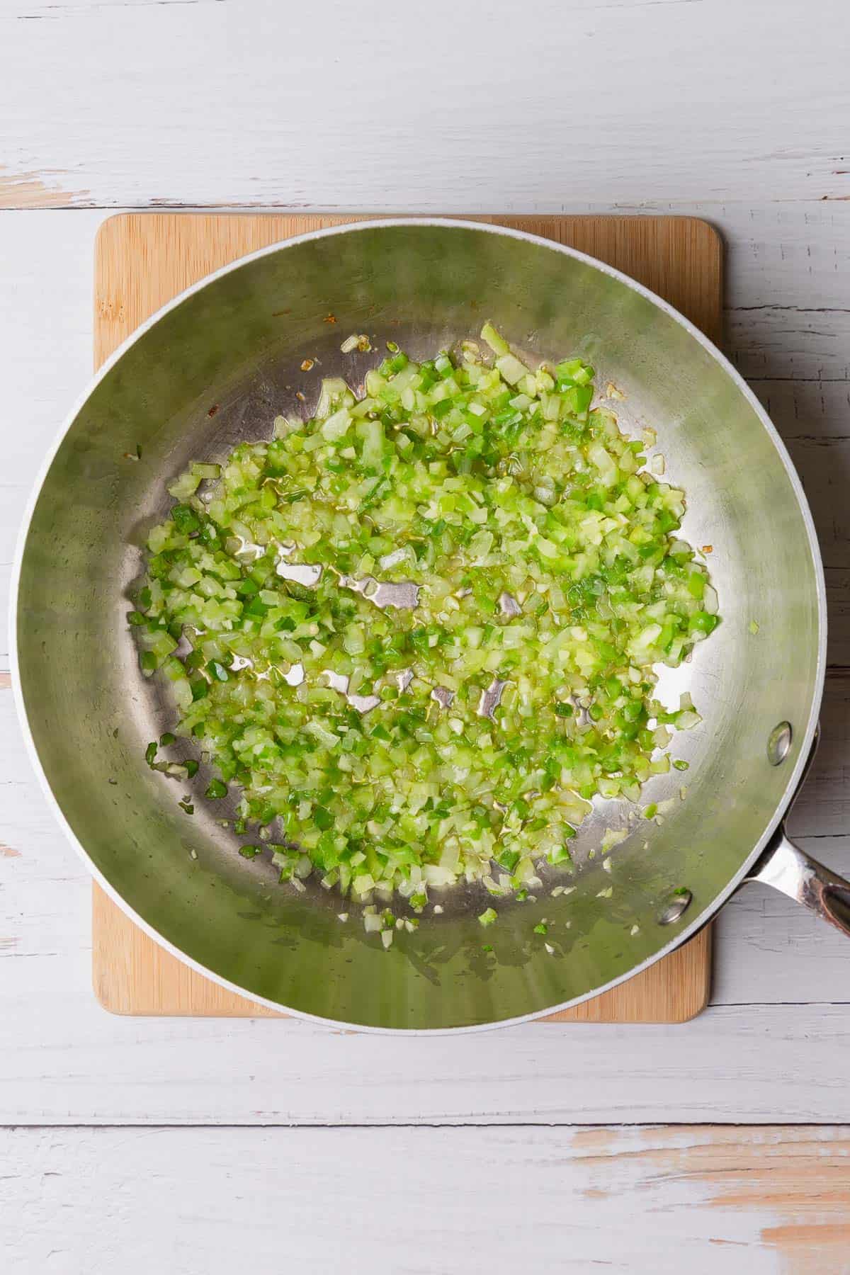 showing how to cook the celery, onions, and garlic
