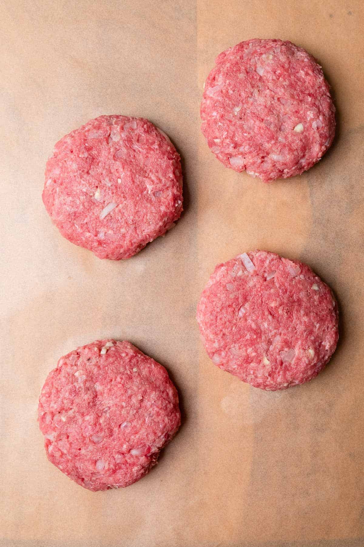 four formed hamburger patties