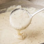 southern white gravy pouring off a ladle