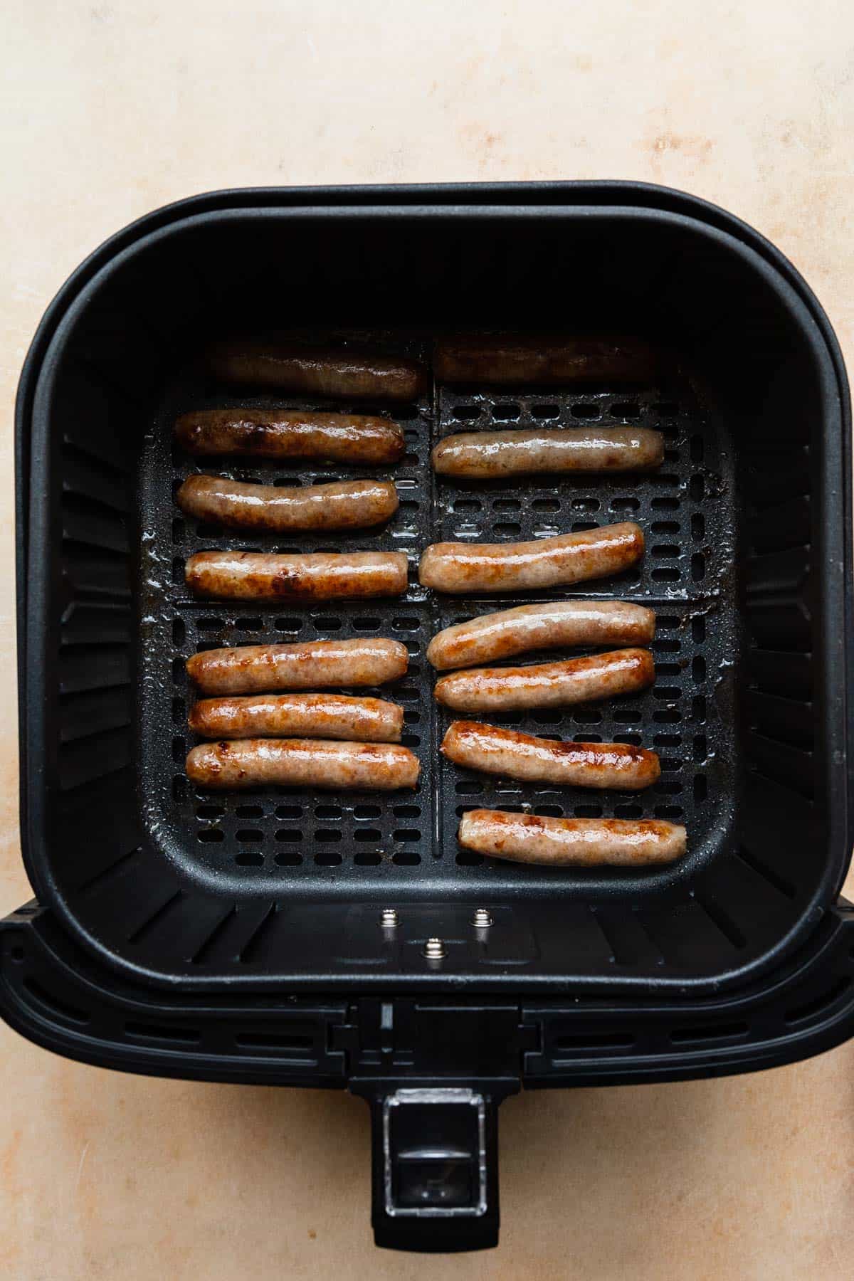 cooked sausage links in the air fryer basket