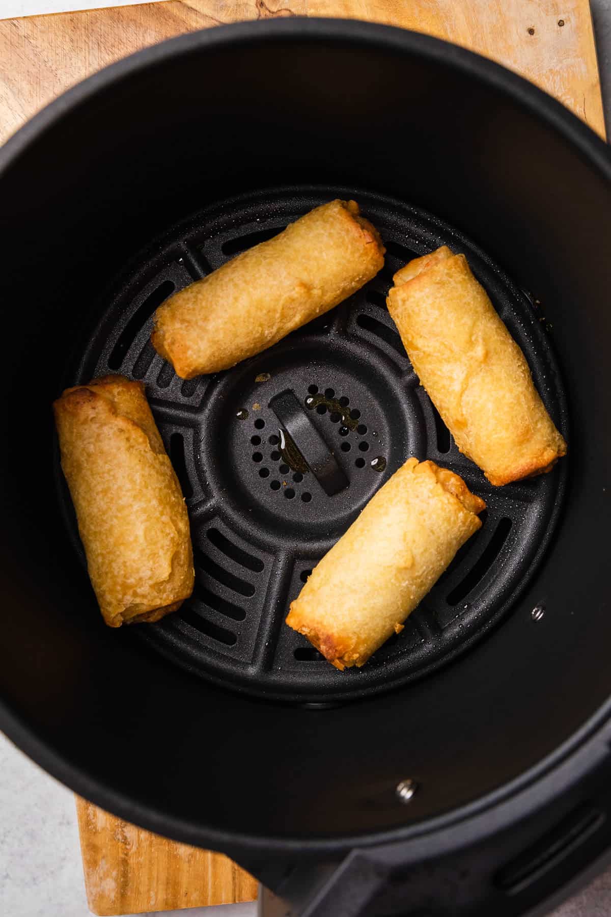 tai pei egg rolls in the basket after being air fried 