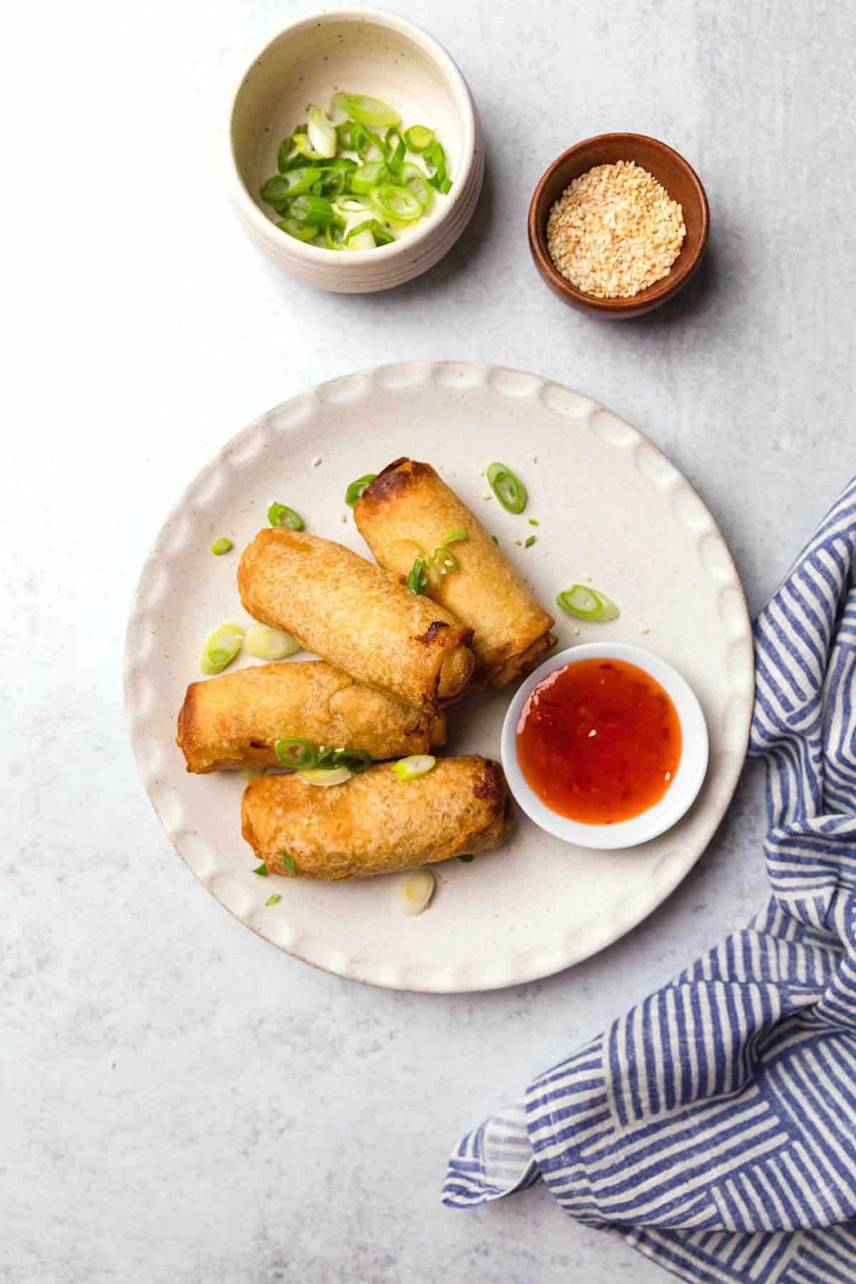 A plate of crispy tai pei egg rolls