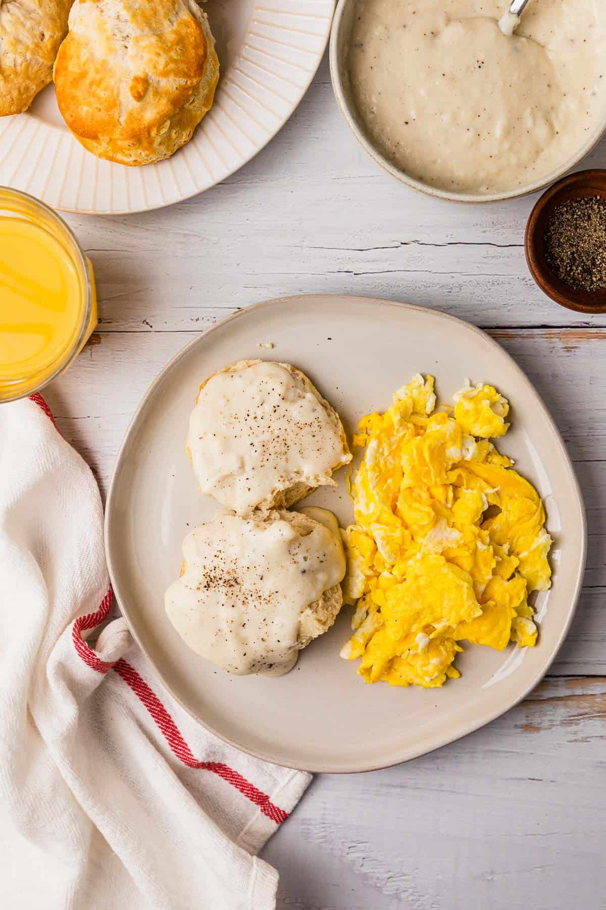 a breakfast plate of biscuits and white cream gravy