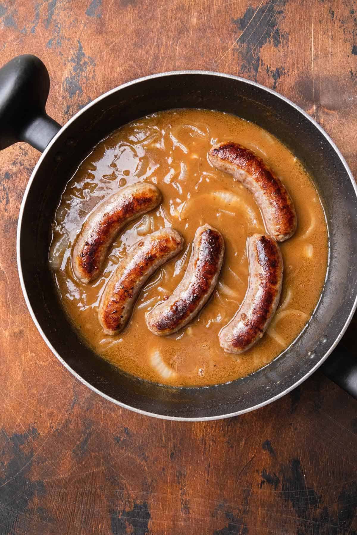 bratwurst simmering in gravy