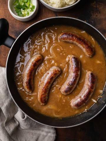 sausages simmering in a stout gravy recipe with onions