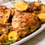 The completed recipe of chicken thigh and potatoes made in the air fryer.