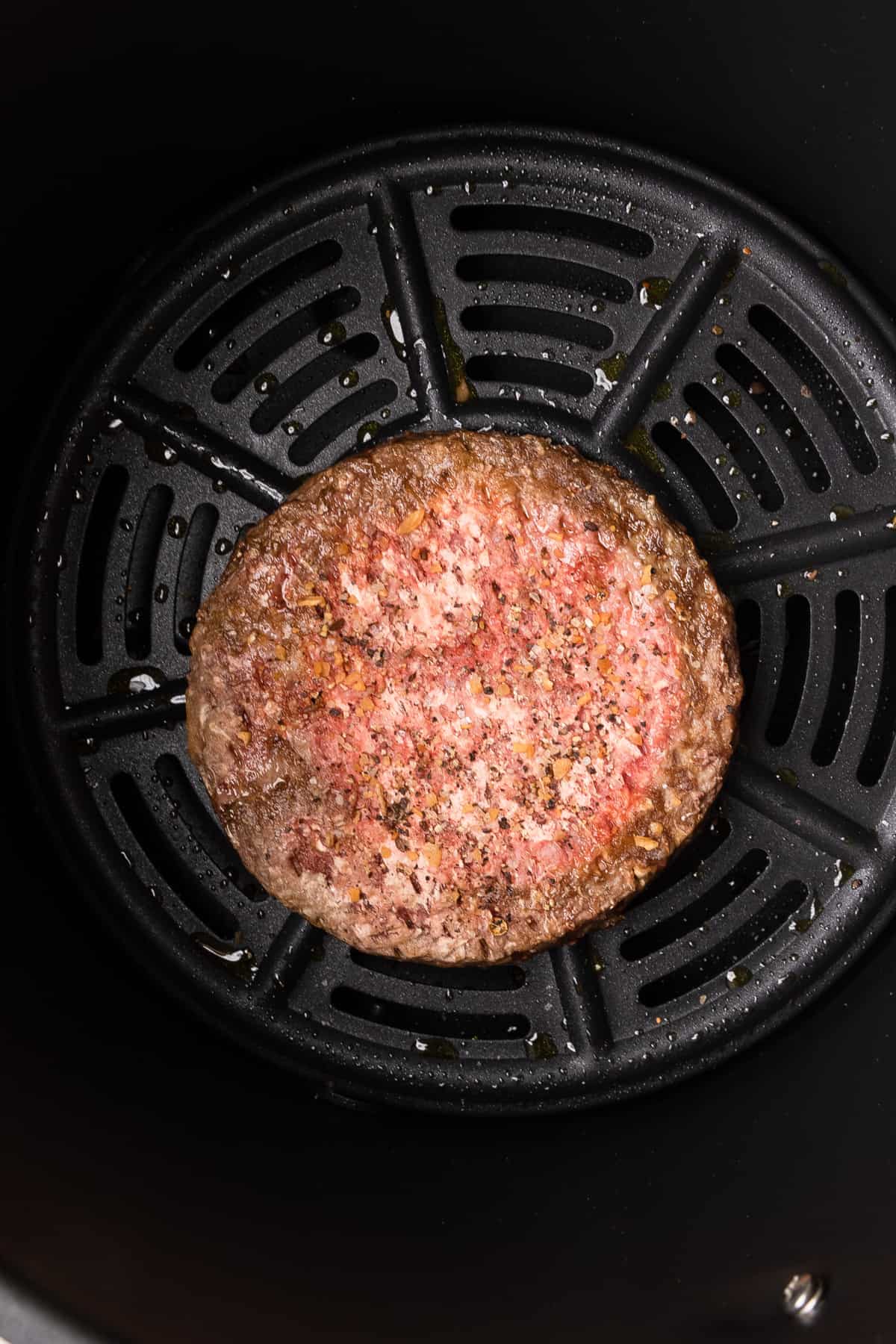 the frozen burger cooked at the halfway point.