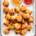 The completed recipe of pigs and a blanket made in an air fryer.