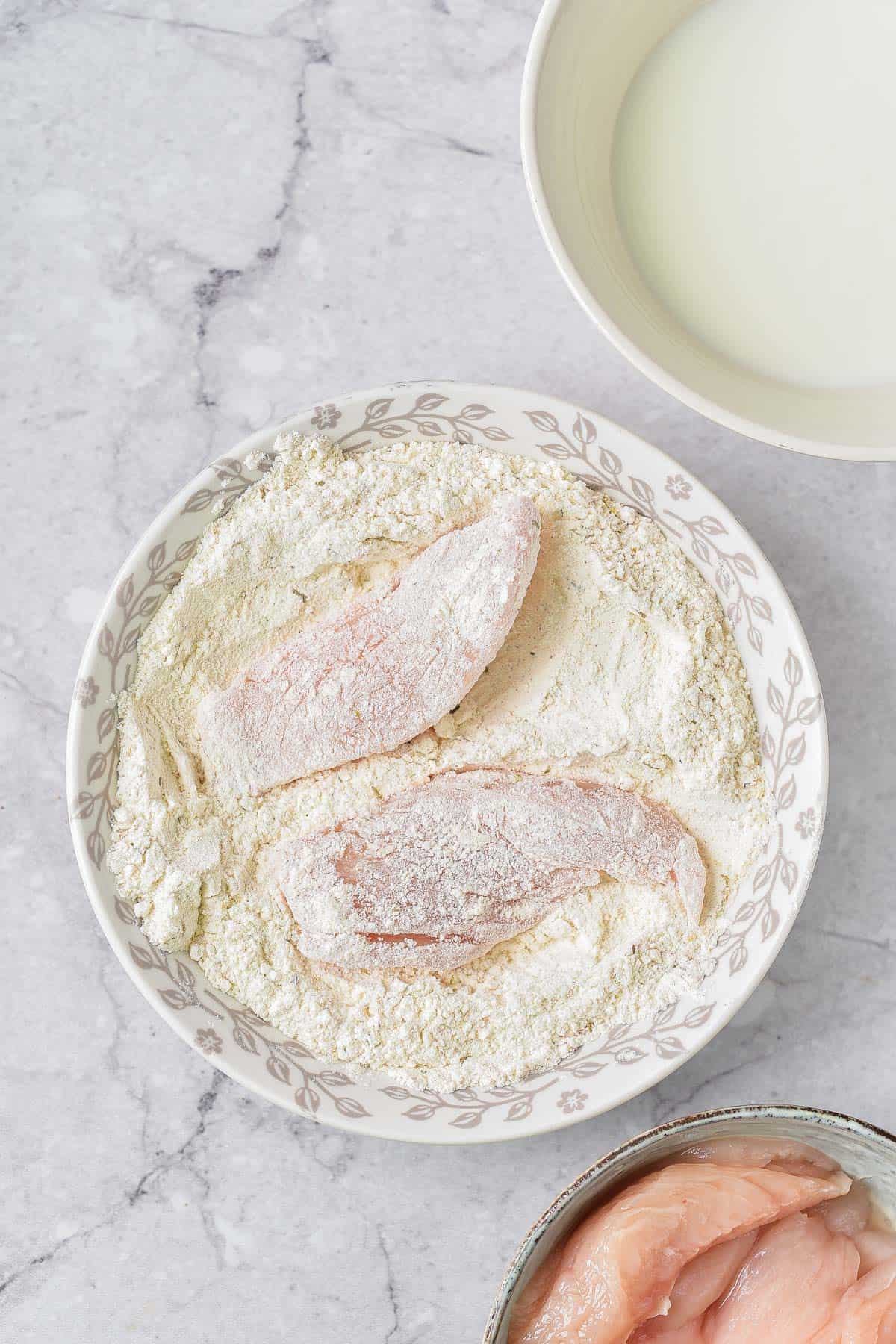 Making the fried chicken.