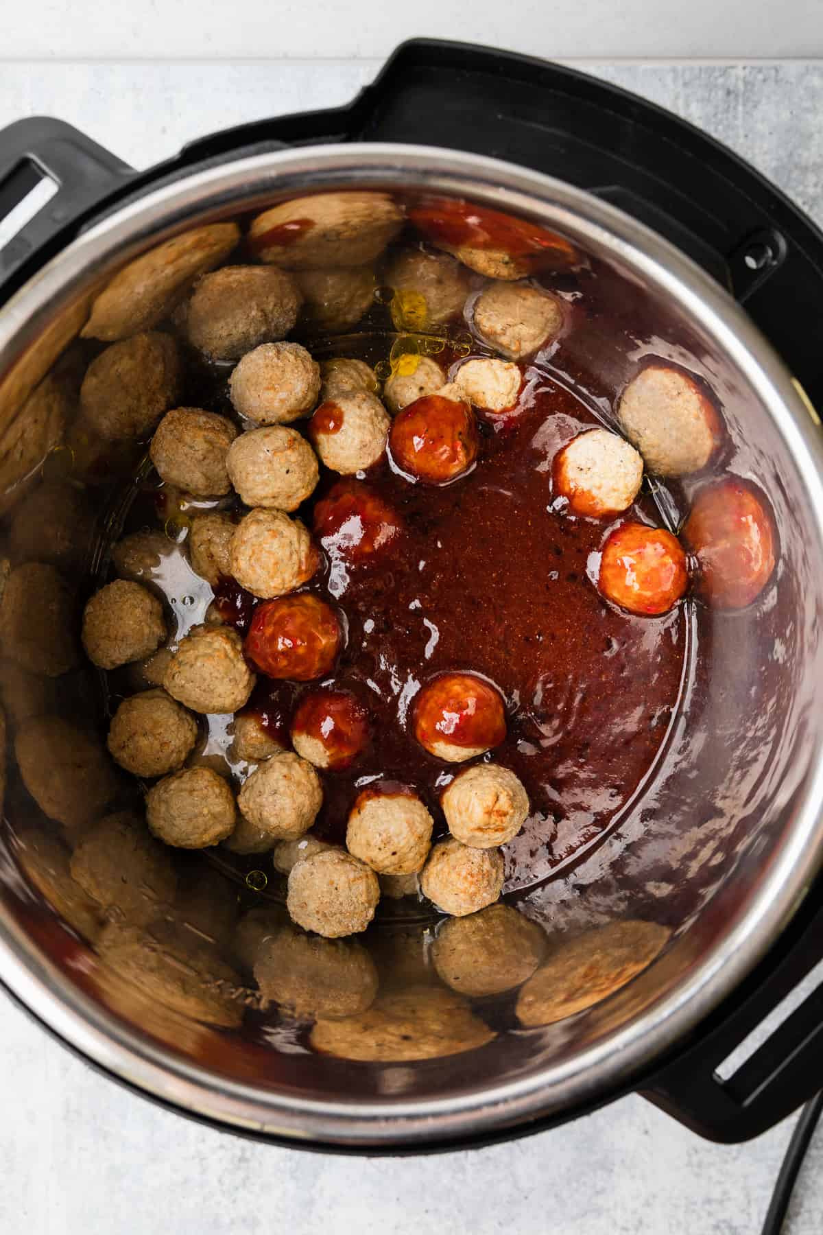 Making instant pot grape jelly meatballs.