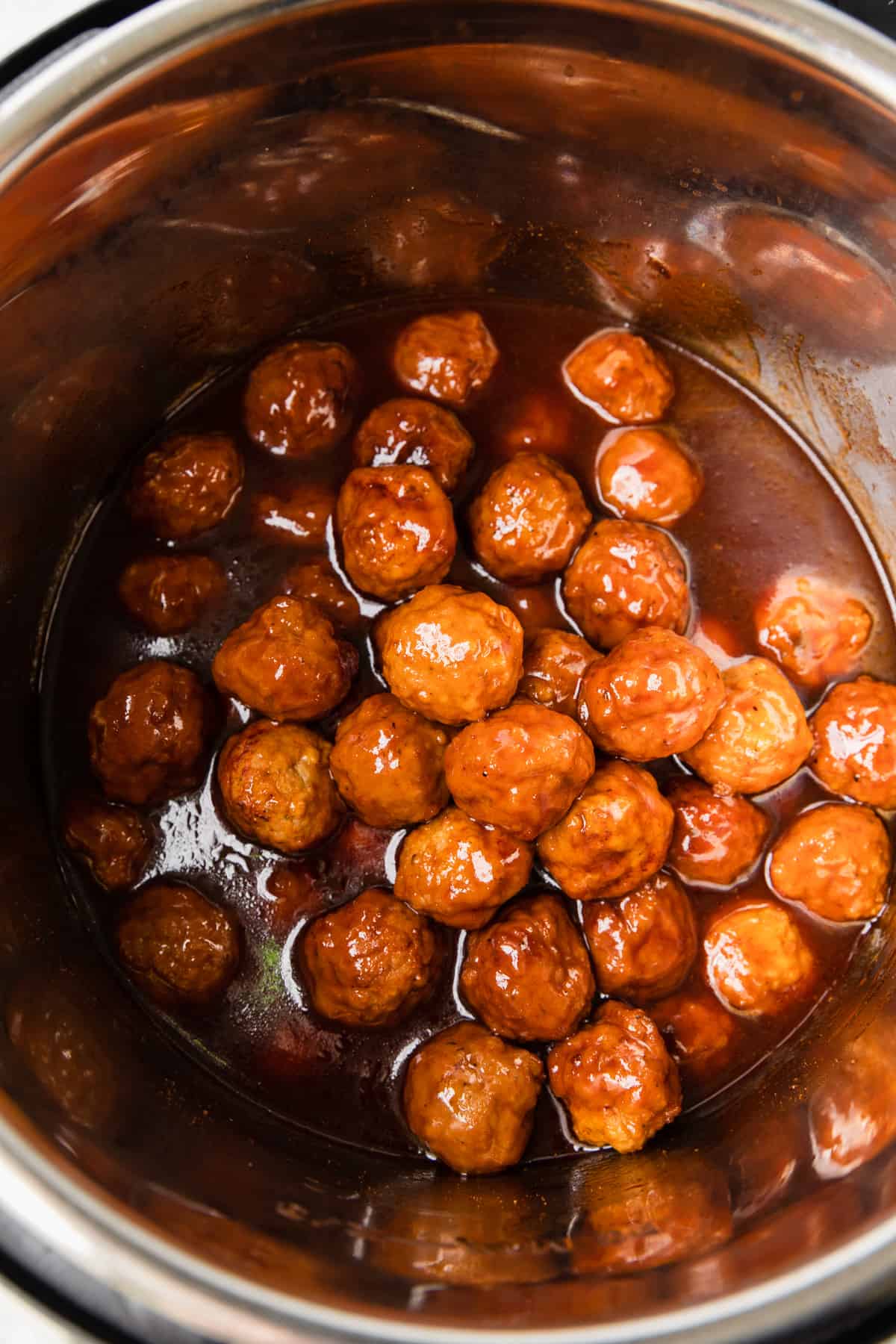 Making the instant pot grape jelly meatballs.