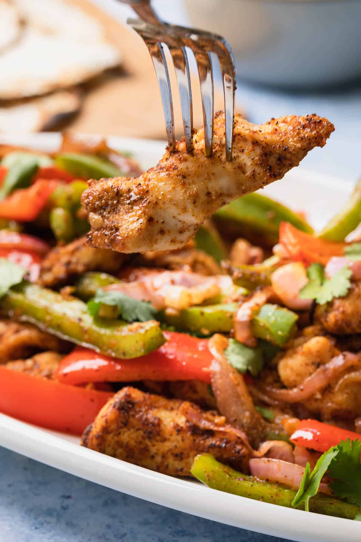 chicken fajita on the end of a fork