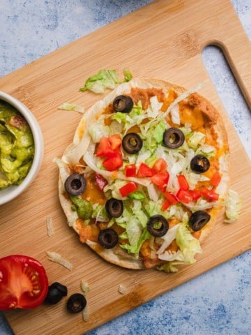 the completed air fried tostadas with some garnishes