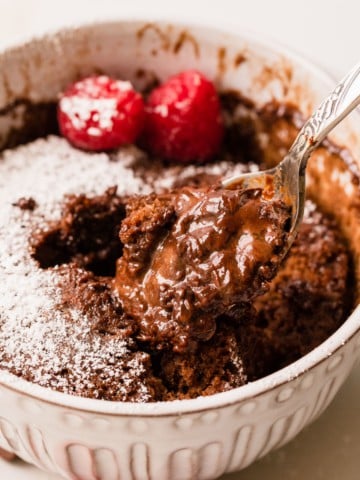 a chocolate lava mug cake being eaten