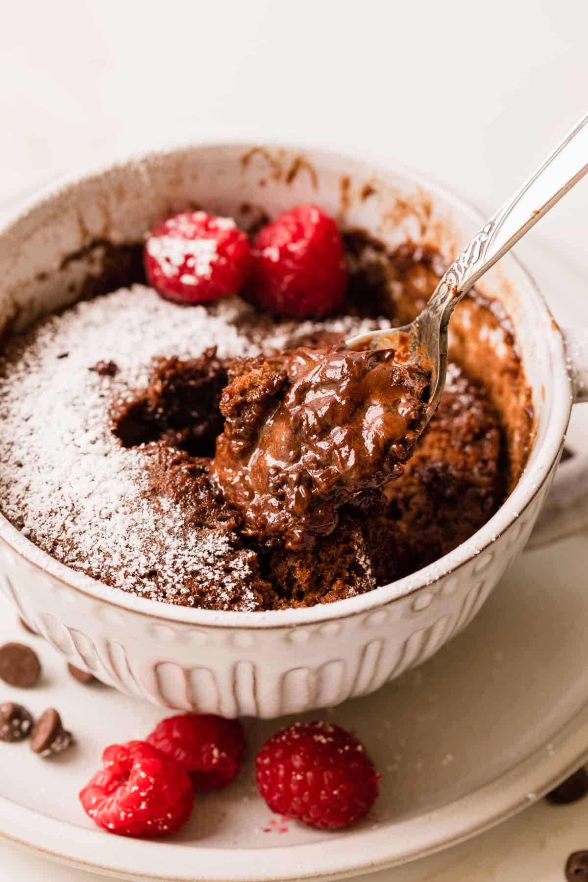 the completed chocolate lava mug cake on a spoon