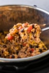 the completed instant pot ground beef and rice being served