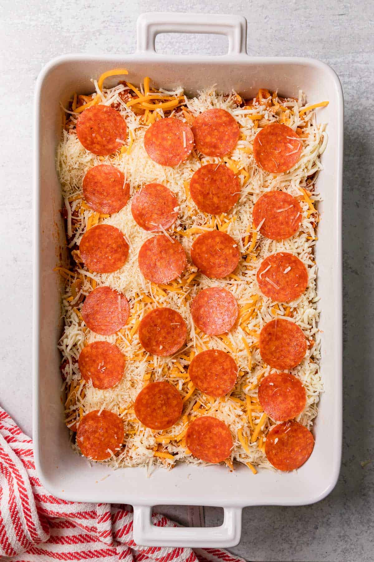 adding pepperoni slices to make the recipe