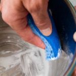 cleaning the instant pot with a sponge