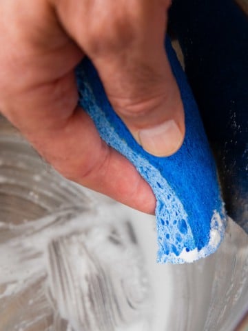 cleaning the instant pot with a sponge