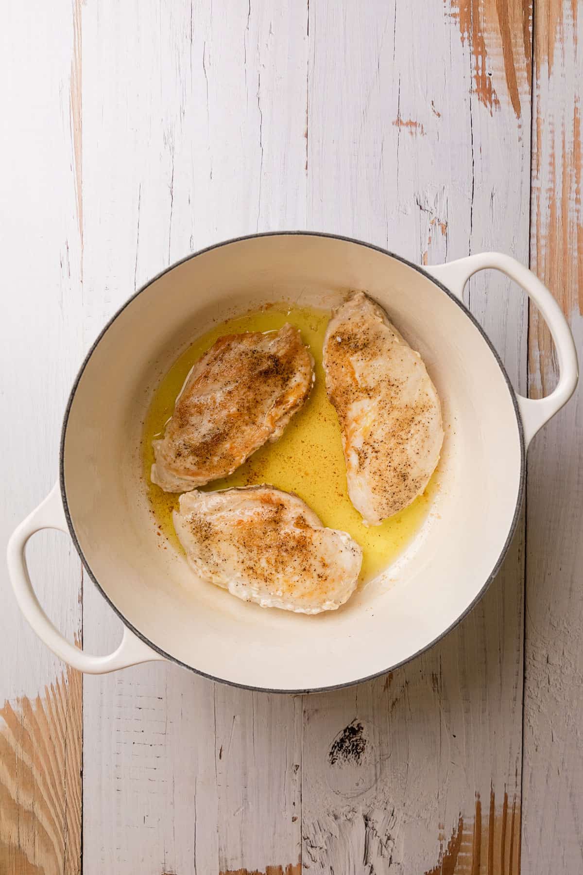 cooking chicken in a large pot