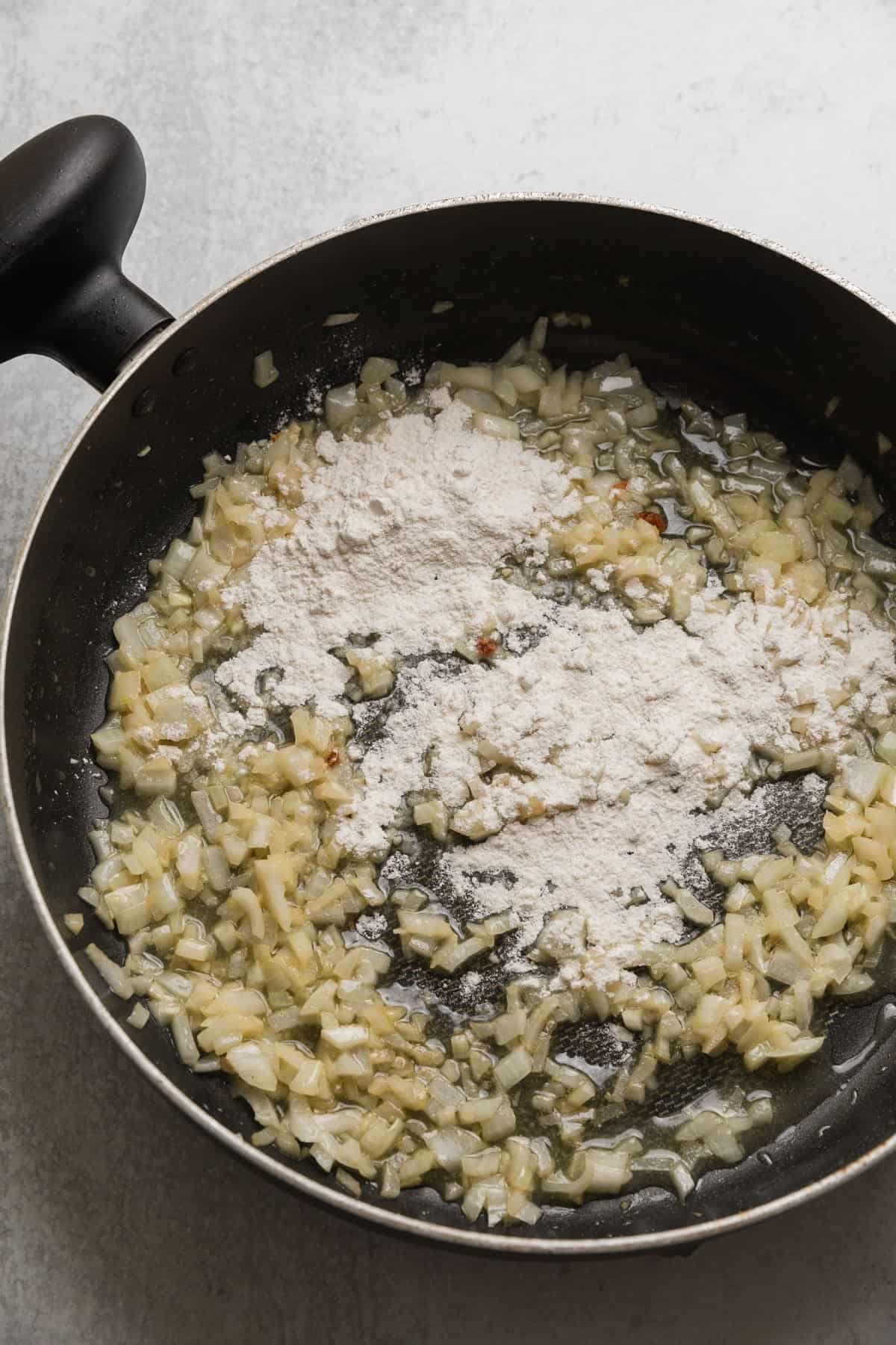 adding flour to make the recipe