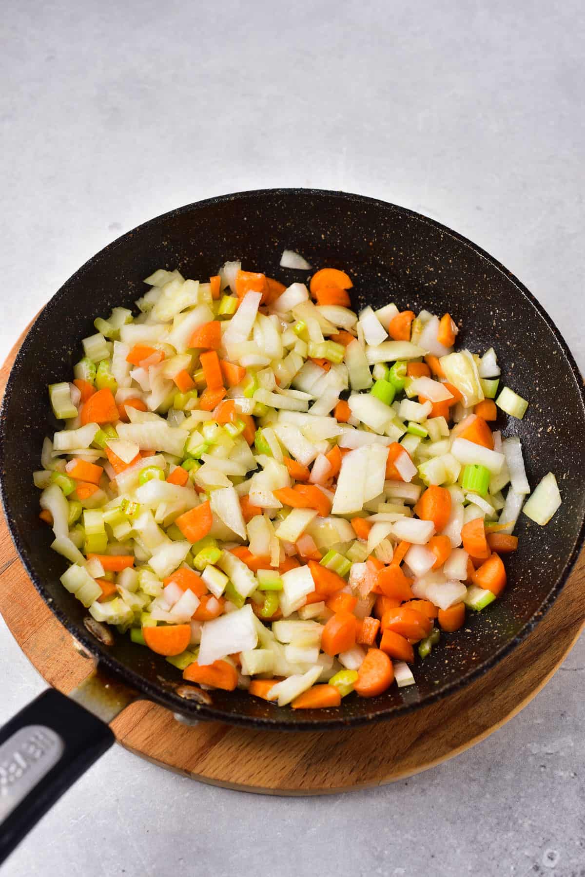 cooking chopped vegetables in oil