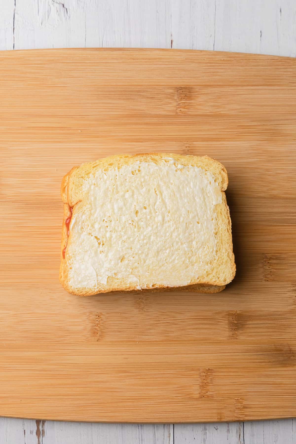 Butter spread on the outside of the pbj.