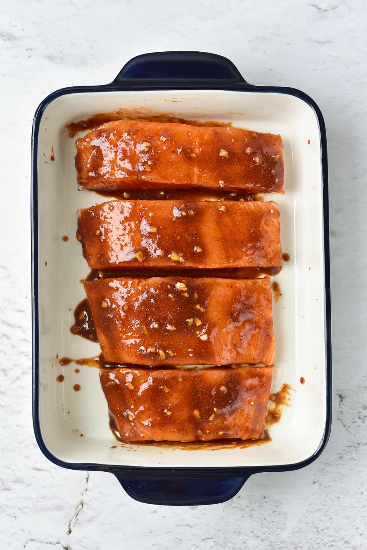 Glazed salmon on a baking dish.