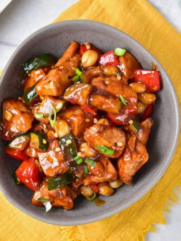 Panda express kung pao chicken recipe completed and placed in a gray bowl.