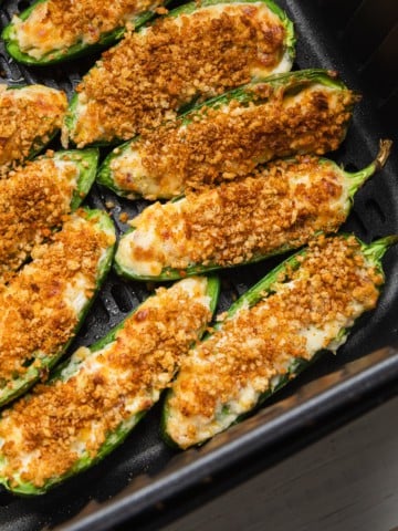 Air Fryer Jalapenos in air fryer basket.