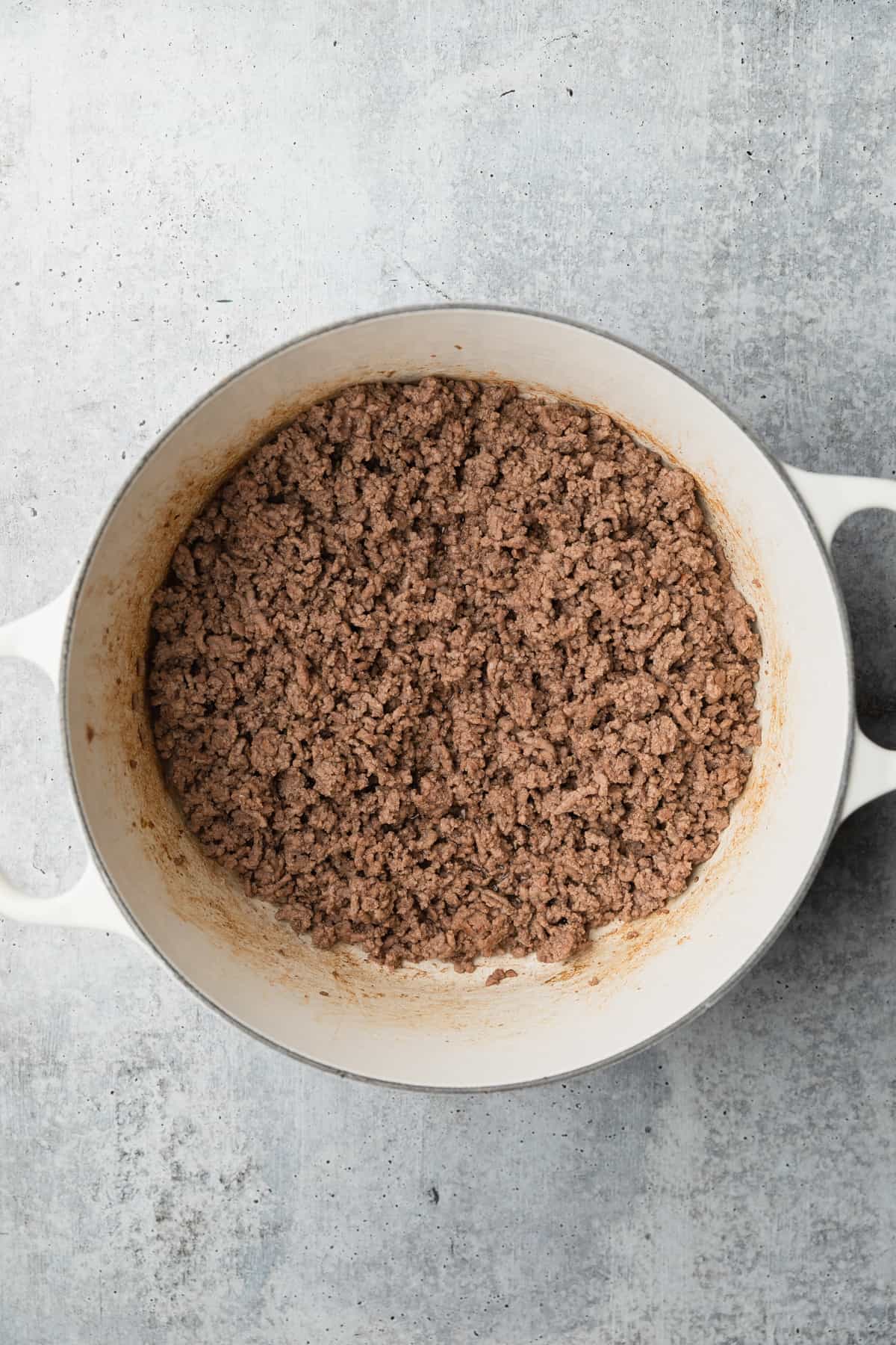 Browning ground beef in a large pot.