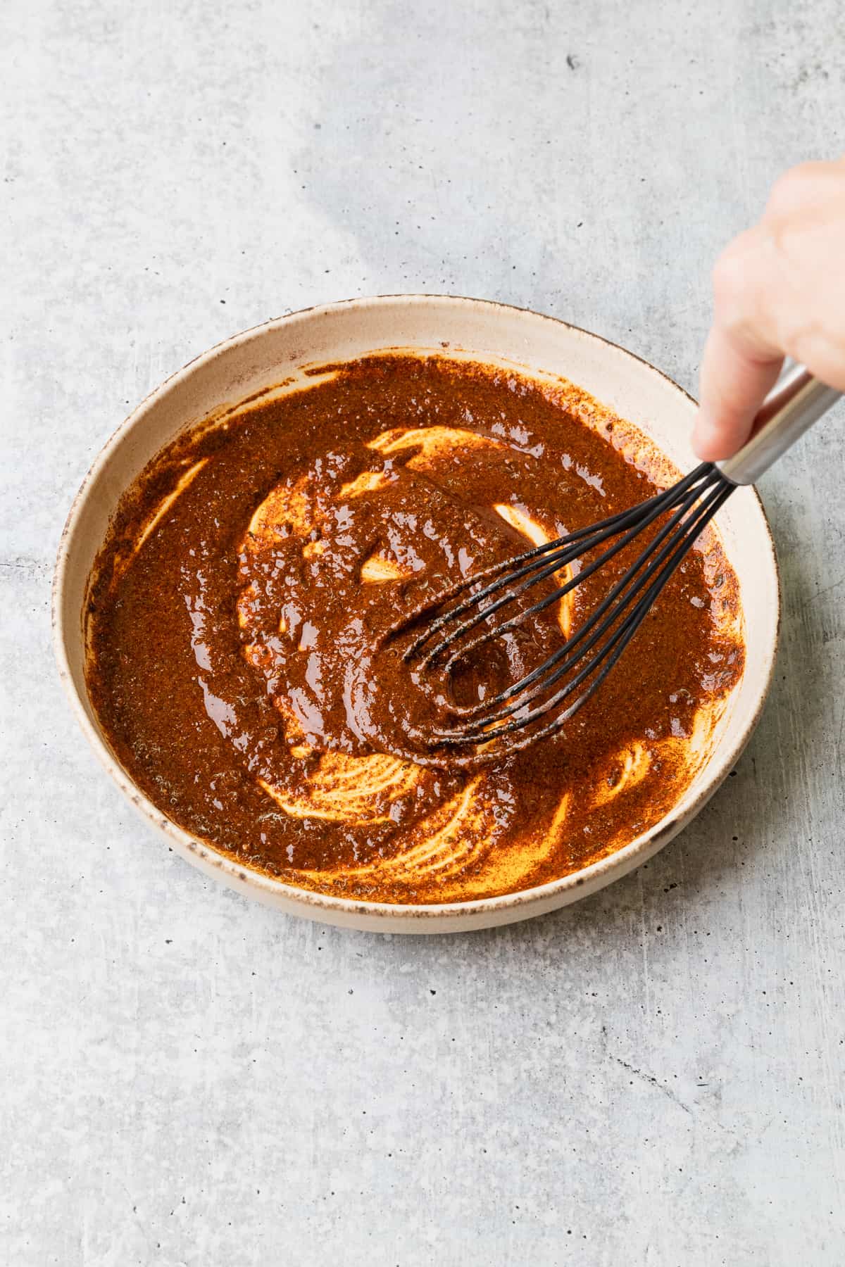 Mixing the blackening spices in a shallow bowl.