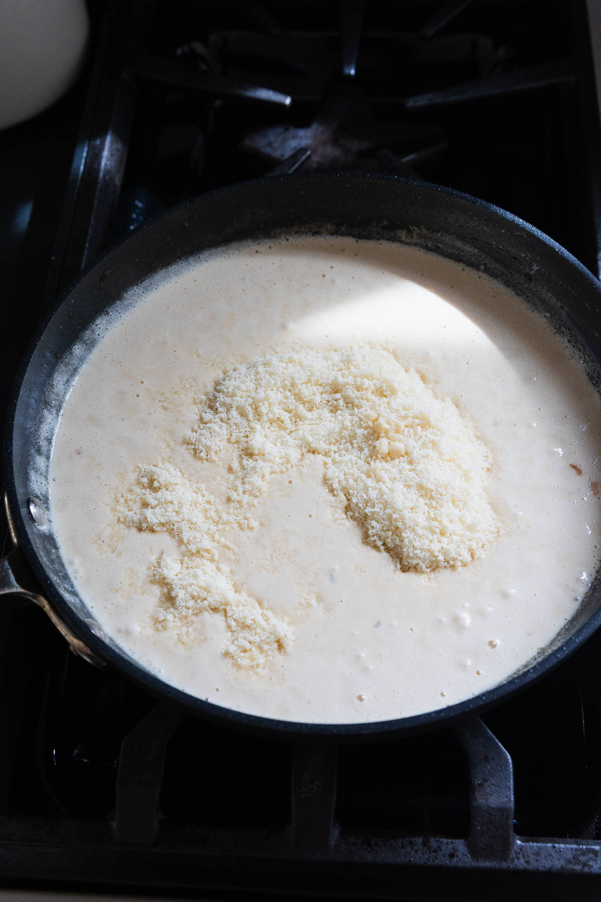 Parmesan cheese added to make alfredo sauce.