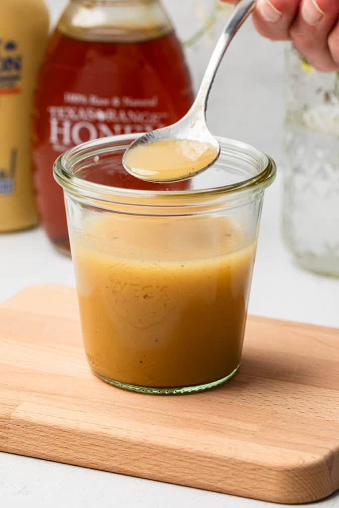 Honey mustard dressing in a jar.
