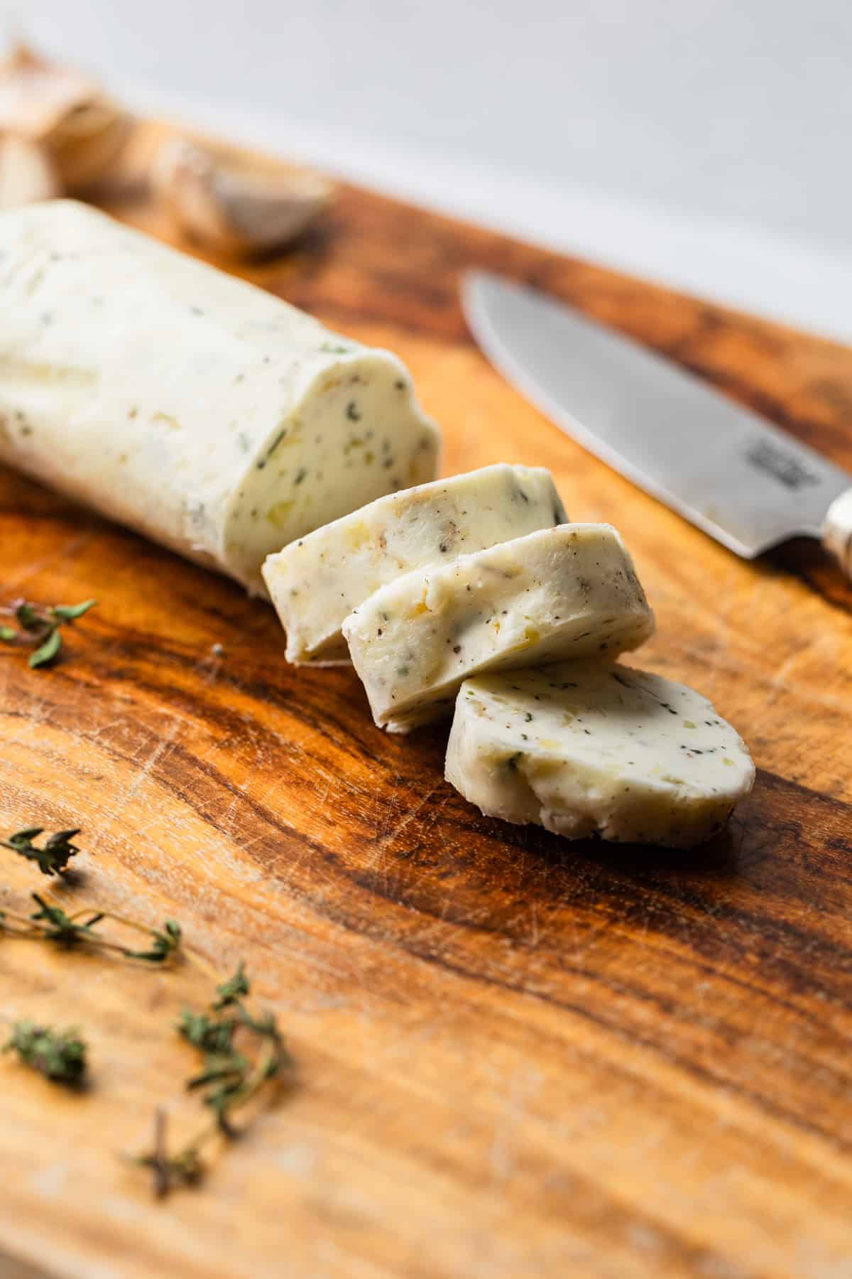 The compound butter sliced on a cutting board.