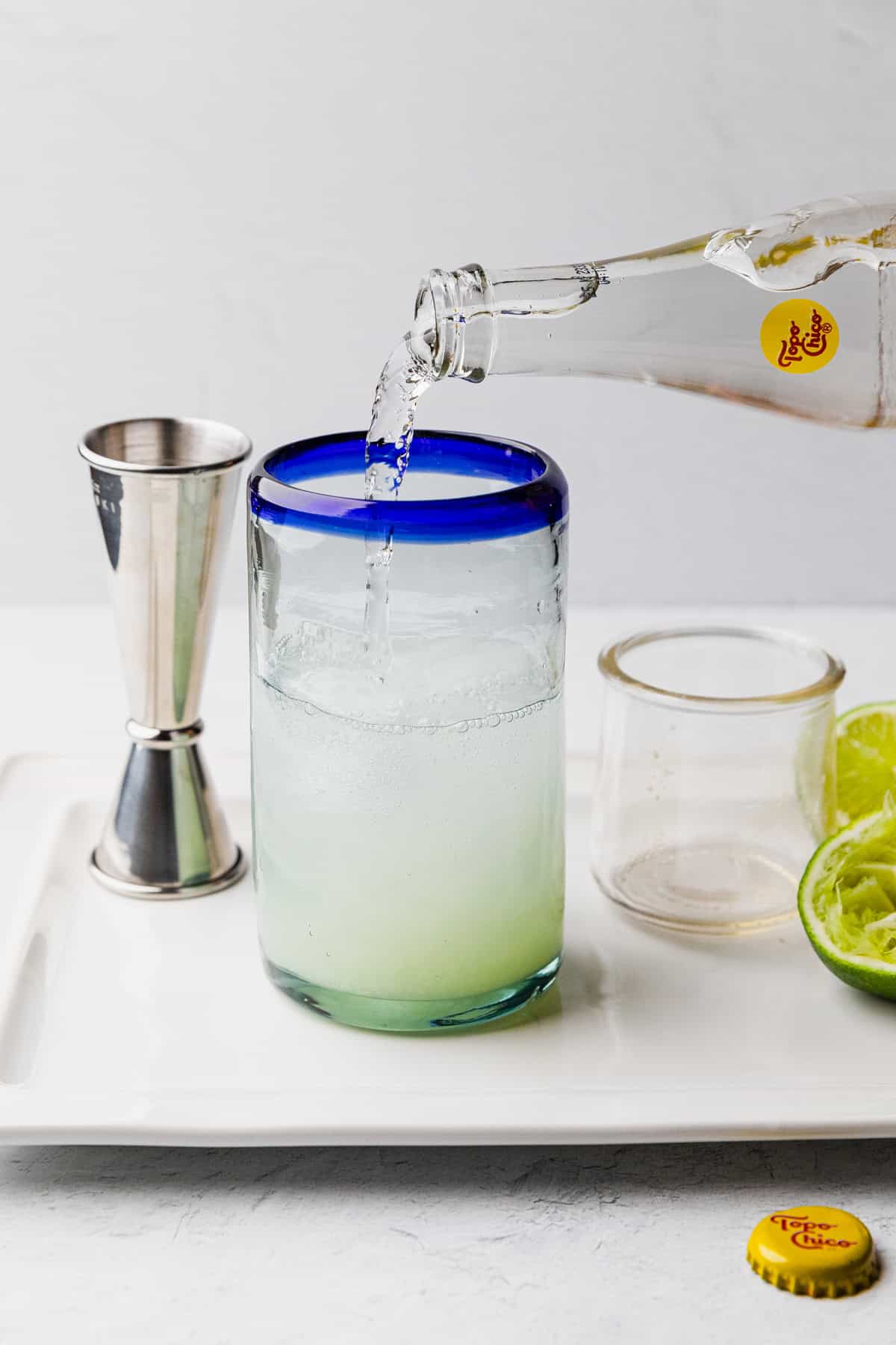 Pour topo chico into glass.