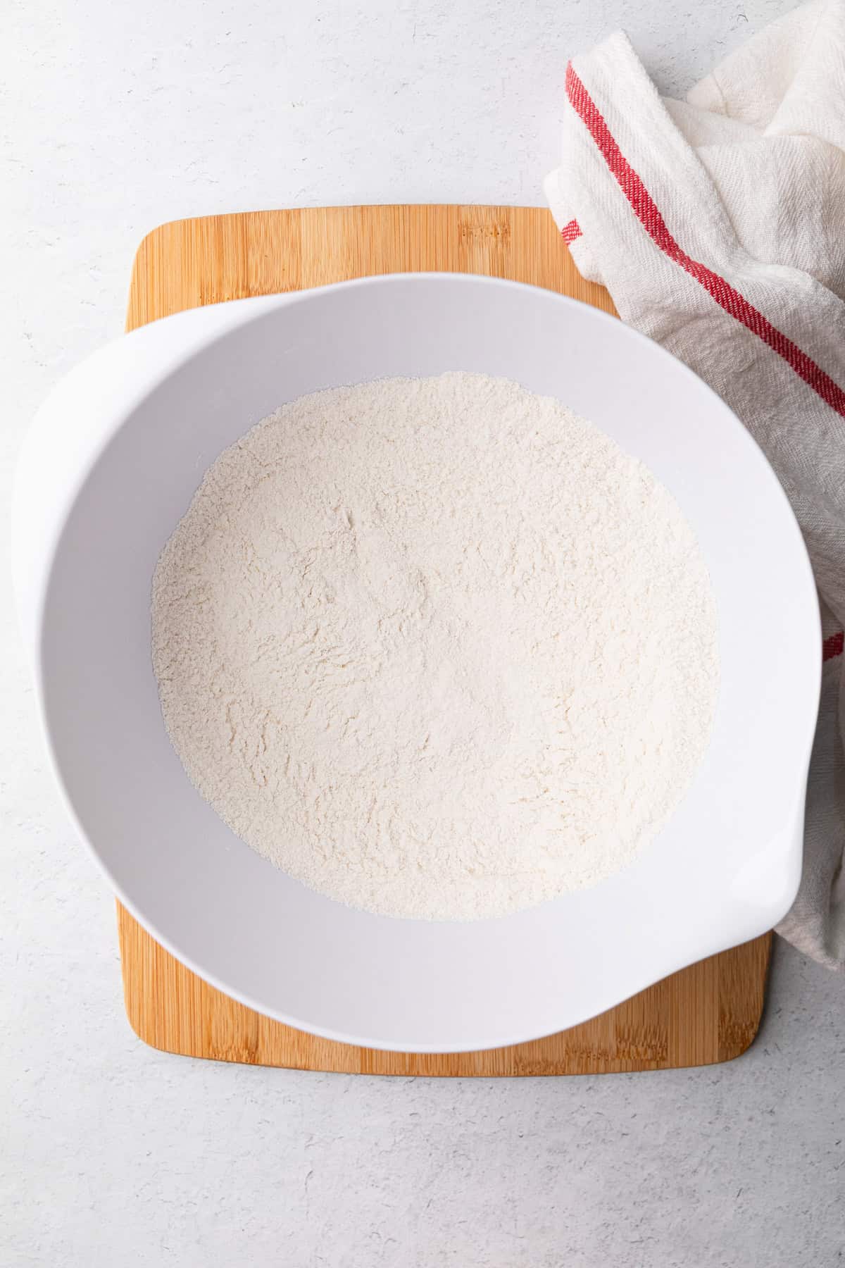 Mixing dry ingredients to make the cake.