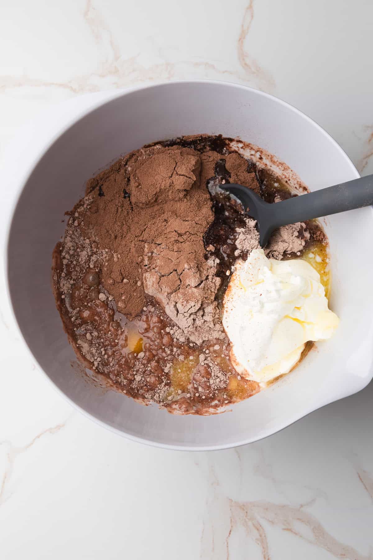 Mixing cake ingredients together.