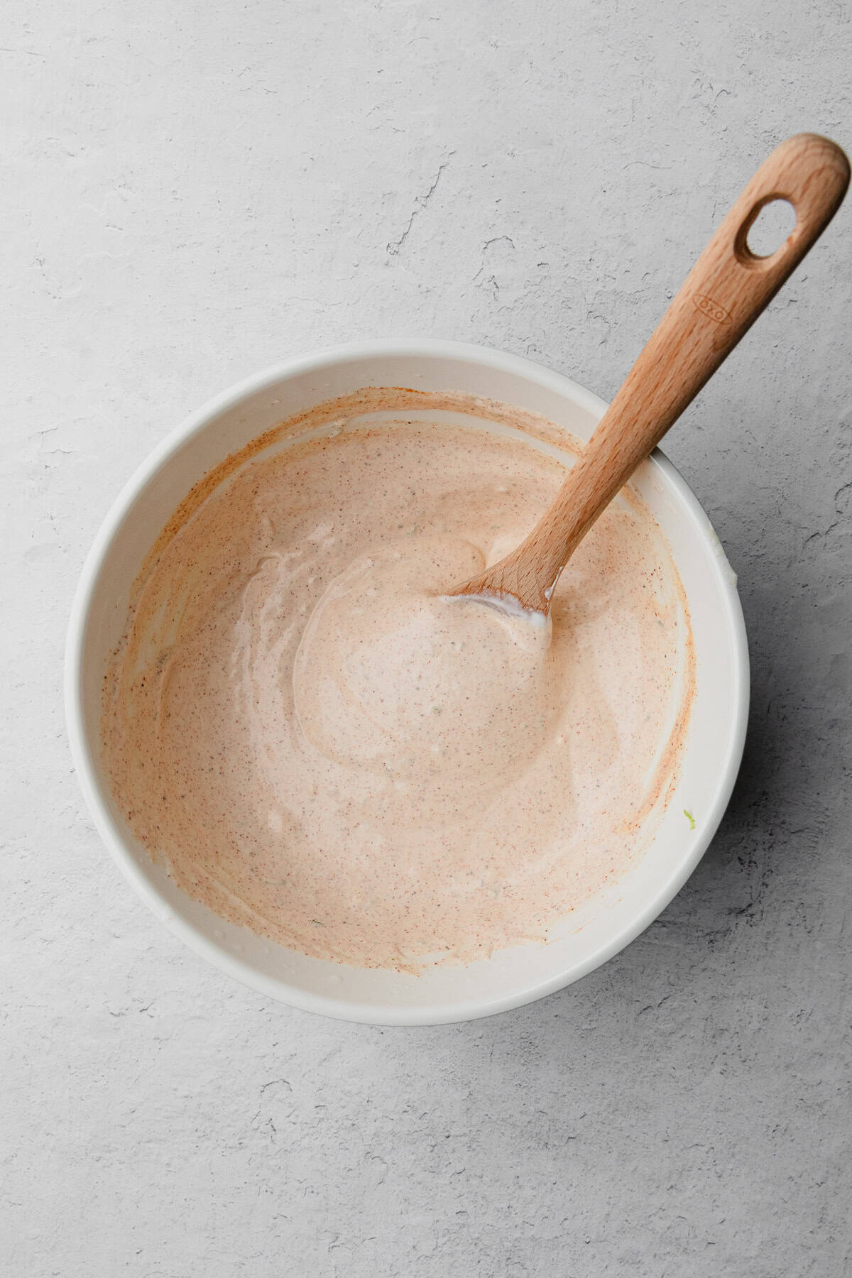 Mixing chili lime dressing.