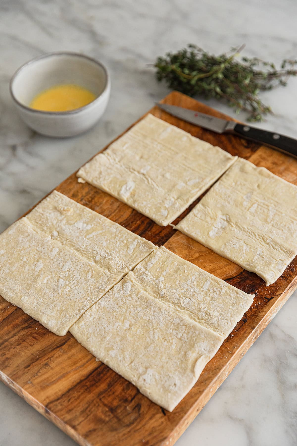 Cutting the puff pastry for the top crust.