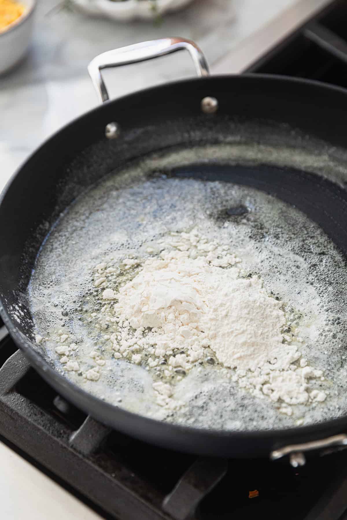 Creating a roux to make the gravy.