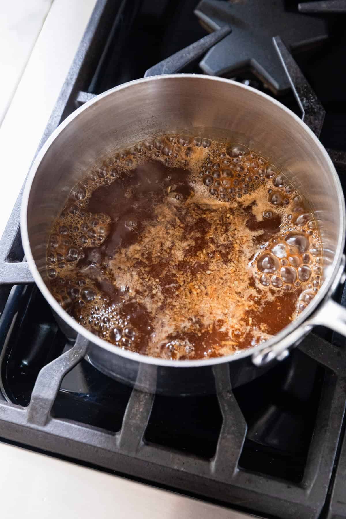 Cooking the marinade on the stove top.