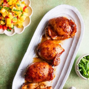 Baked Hawaiian chicken on a platter.